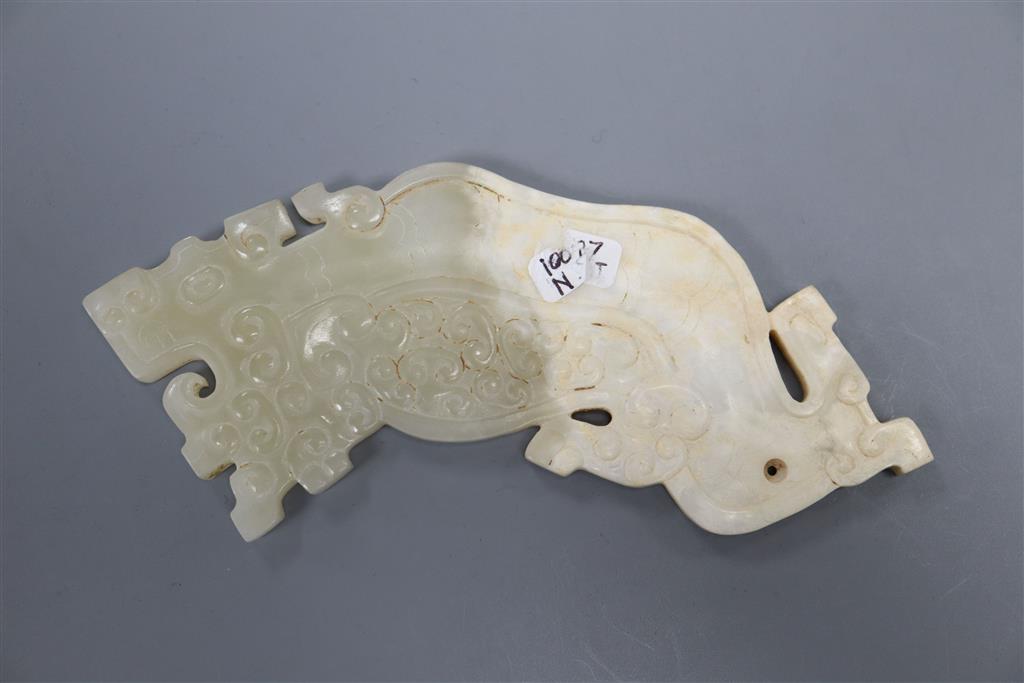 A Chinese archaistic pale celadon and calcified jade plaque